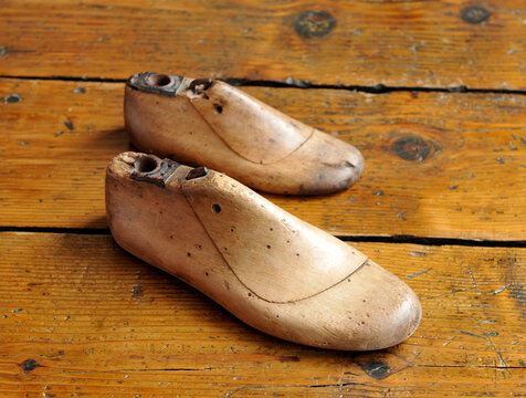Antique pair of wooden shoe lasts. Shoe tree for making handmade shoes. Wooden shoe tree for shaping shoes. Shoemaker workshop