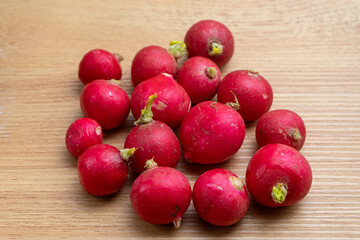 Fresh radishes on a kitchen counter, ready to be prepared for a healthy meal. Vibrant colors and...