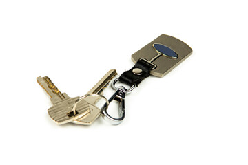 House keys with metal keychain, close-up on white background