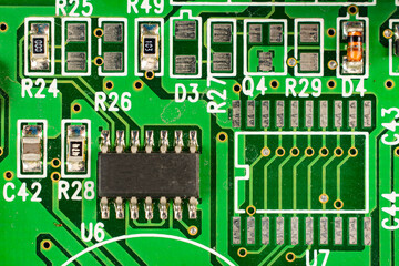 Close-up of a circuit board with microcircuits from an electrical appliance or computer. Selective...