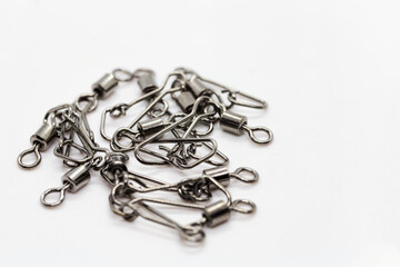 Fishing accessories, chromed swivels with snap hooks useful to connects terminals, beams and other accessories to the main fishing line