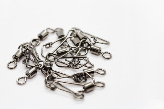 Fishing accessories, chromed swivels with snap hooks useful to connects terminals, beams and other accessories to the main fishing line