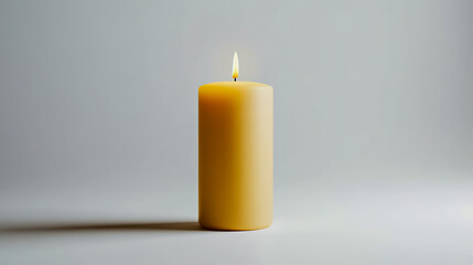 Tan candle mock-up standing upright, lit with a soft, warm flame.