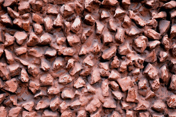 Light red stone texture background with rough surface