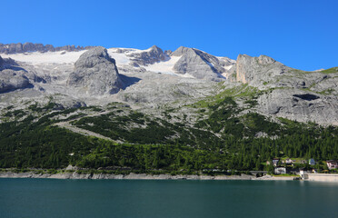 Fedaia lake is an alpine lake in Trentino Region and glacier of Marmolada Mountain  in Northern Italy