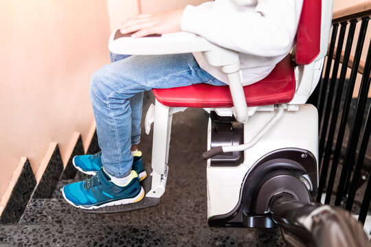 Close-Up of Child's Legs on Stairlift