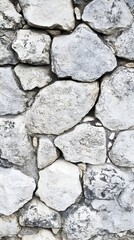 Obraz premium Textured Stone Wall with Varied Rock Shapes and Gray Tones, Perfect for Backgrounds in Architecture, Nature, and Design Projects