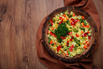 couscous with vegetables, paprika, carrots, string beans, corn, homemade, top view, no people,