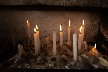 Set of lit and melted candles