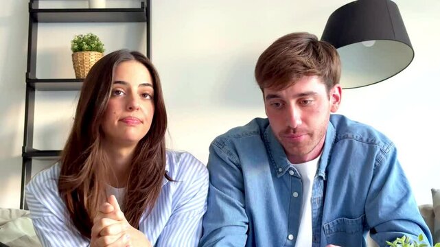 The man and woman engage in a serious video call on a laptop with a specialist about resolving their relationship problems and overcoming the emotional barriers affecting their unity. Cheating partner