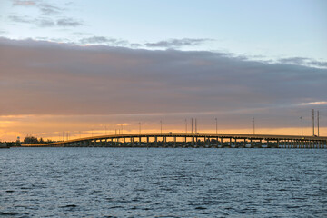 Barron Collier Bridge and Gilchrist Bridge in Florida with moving traffic. Transportation...