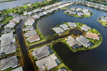Flooded residential area with underwater houses from hurricane rainfall water in Florida suburban...