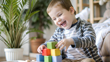 Happy Preschool Boy with Developmental Delays and Autism Building Colorful Blocks at Home