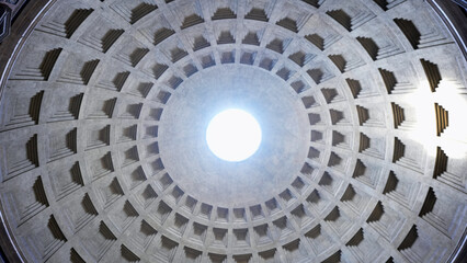 A breathtaking view of the Pantheon dome in Rome, showcasing its central oculus and coffered ceiling design. 