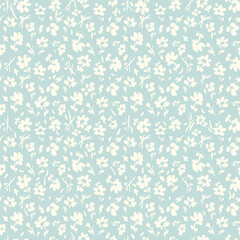 All over vector seamless repeat pattern with tiny ditsy tossed cream flowers on light blue background. Simple and versatile retro cottage everyday ditsy floral backdrop. Shabby chic floral backdrop.