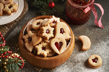 Traditonal Linzer Christmas cookies filled with strawberry marmalade and dusted with sugar