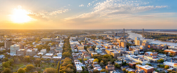 Old historic city architecture in Southern USA. View from above of illuminated streets of Savannah, Georgia at night