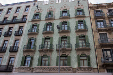 Fototapeta premium 14.11.2024. beautiful wall facade with openwork patterns, balconies and wooden shutters on the windows.
