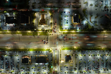 Traffic rush at shopping malls and small businesses in evening time in North Port, Florida. USA transportation and retail infrastructure concept