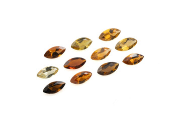 Collection of Natural Tourmaline Gemstones in Various Shades of Yellow, Orange, and Brown