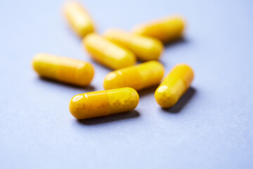 Vitamin C capsules. Bright background. Close up. Copy space.
