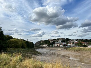 clouds over the river and village