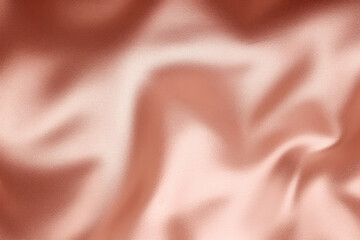Fototapeta premium A close-up of rich rose-colored fabric, showcasing smooth folds and a luxurious, contemporary appearance.