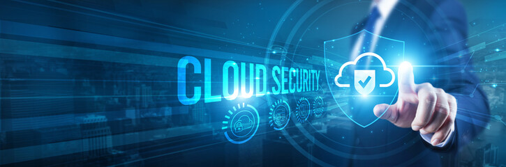 Businessman hand touches a shield, cloud security protection technology integration. The concept...