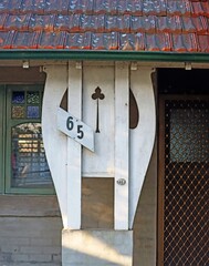 Decorative verandah post holding up the roof on a old house