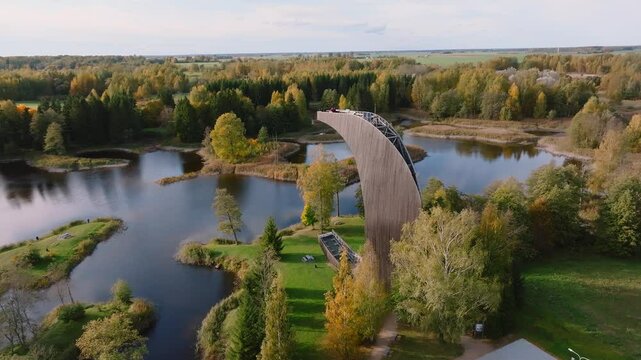 Amazing aerial view of Kirkilai karst lakes and lookout tower in the bright sunny autumn morning, Birzai eldership, Panevezys county, Lithuania
