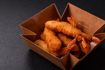 Hot crispy shrimp breaded with salt and spices with white sauce