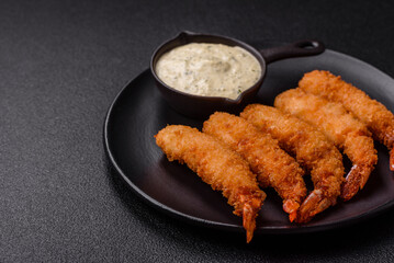 Hot crispy shrimp breaded with salt and spices with white sauce