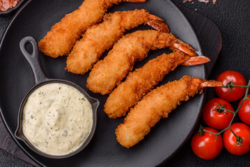 Hot crispy shrimp breaded with salt and spices with white sauce