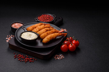 Hot crispy shrimp breaded with salt and spices with white sauce