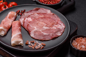 Antipasto jamon, prosciutto, sausage, sliced with tomatoes, salt and spices