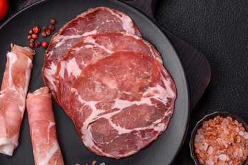 Antipasto jamon, prosciutto, sausage, sliced with tomatoes, salt and spices