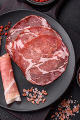 Antipasto jamon, prosciutto, sausage, sliced with tomatoes, salt and spices