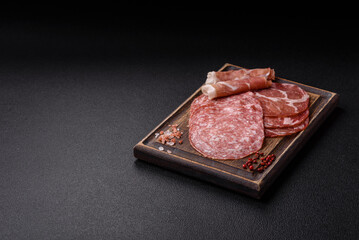 Antipasto jamon, prosciutto, sausage, sliced with tomatoes, salt and spices