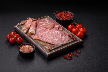Antipasto jamon, prosciutto, sausage, sliced with tomatoes, salt and spices