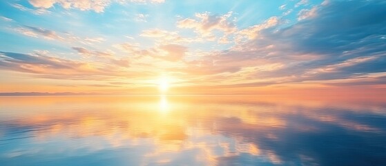 Obraz premium Calm ocean reflecting a vibrant sunset sky with colorful clouds.