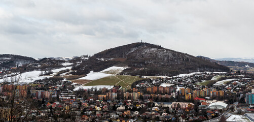 Koprivnice town with Bila hora hill above in Czech republic during early winter cloudy day
