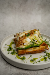 Belgian waffles with chicken, avocado and parmesan sauce