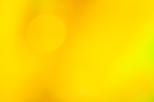 Bright yellow abstract background with smooth gradient and soft bokeh effects