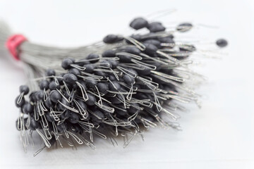 Fishing accessories, many line stops used in multiple roles depending on the type of fishing practiced