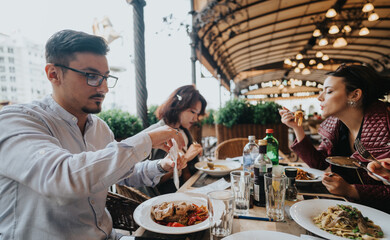 A group of colleagues having a discussion over lunch at a restaurant terrace. They engage in...