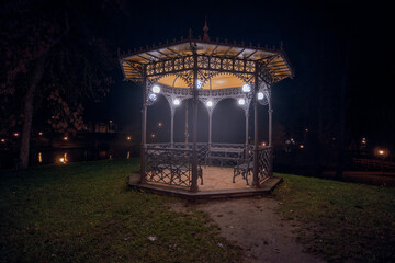 Illuminated Gazebo in Park at Night