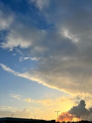 sunset in clouds over the town