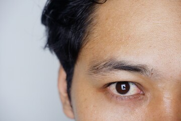 Close up beautiful brown eyes of a young boy. Wide open brown eyes looking to the camera
Important information