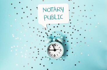 Clock with the words notary public written above it