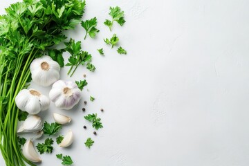 Fresh garlic, parsley and peppercorns on a white background.
